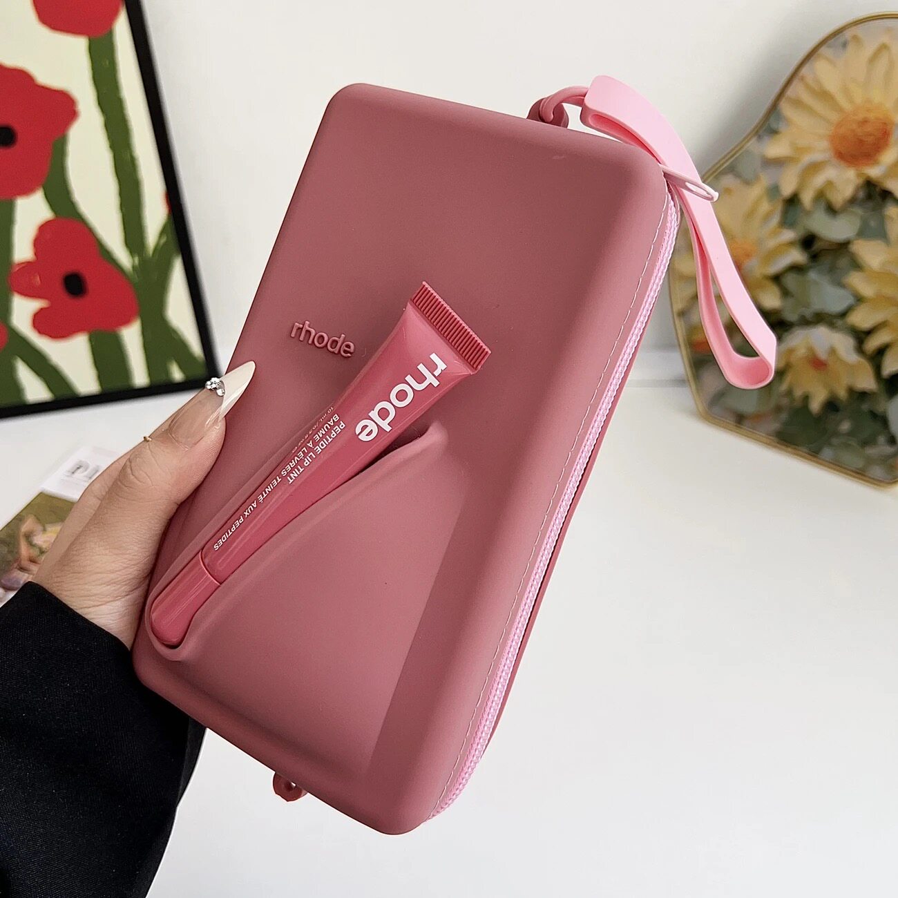 Rhode bag with Peptide Lip Tint lip balm in various designs and