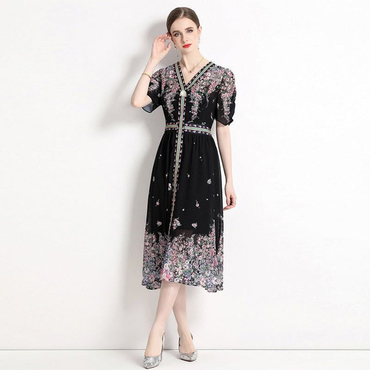 Elegant black chiffon dress with floral prints, puff sleeves, and V-neck, perfect for high-end fashion summer 2024.