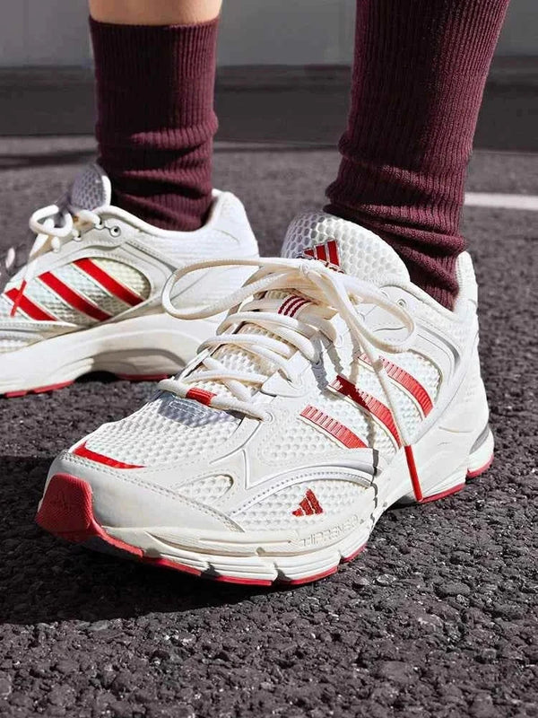Adidas أديداس حذاء SPIRITAIN 2.0 "Light Seeker" أبيض مع خطوط حمراء وتصميم شبكي خفيف ومريح للرياضة والمشي
