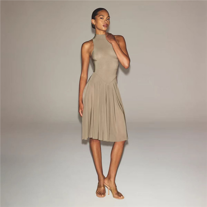 SKIMS high neck midi dress with sleeveless design and wide flowing skirt in beige on model