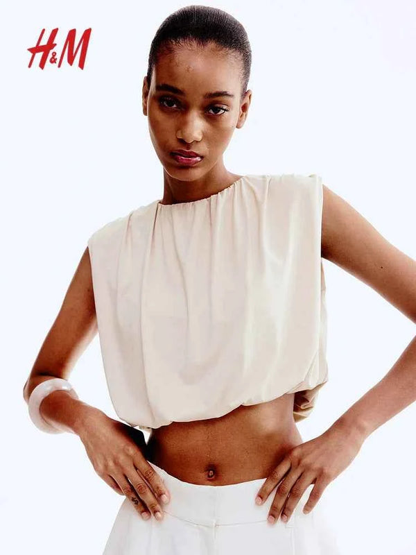 Sleeveless beige draped crop top from H&M, featuring a round neck and softاتش اند ام jersey fabric.