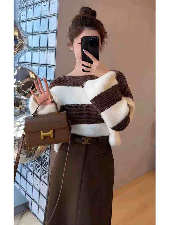 Elegant winter outfit with striped cardigan and midi skirt in brown and white colors