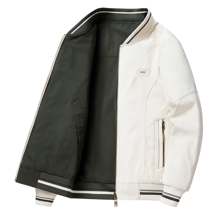 جاكيت لونين قصير رياضي بألوان أبيض و أخضر مع ياقة وأساور مخططة وسحاب مزدوج وجيوب بسحاب من القماش الكانفاس مقاوم وخفيف