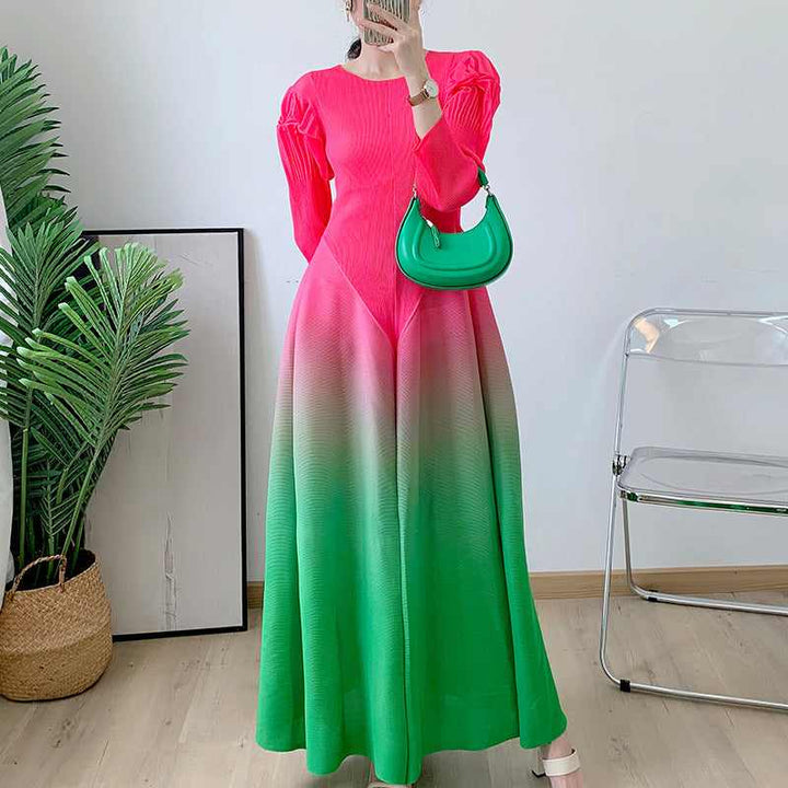 Elegant long-sleeve gradient dress with pleated design, suitable for all occasions.