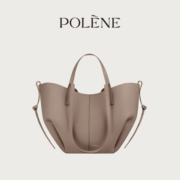 Polène Cyme Mini tote bag in camel leather with soft curves and dual-use design, featuring short and long shoulder straps.