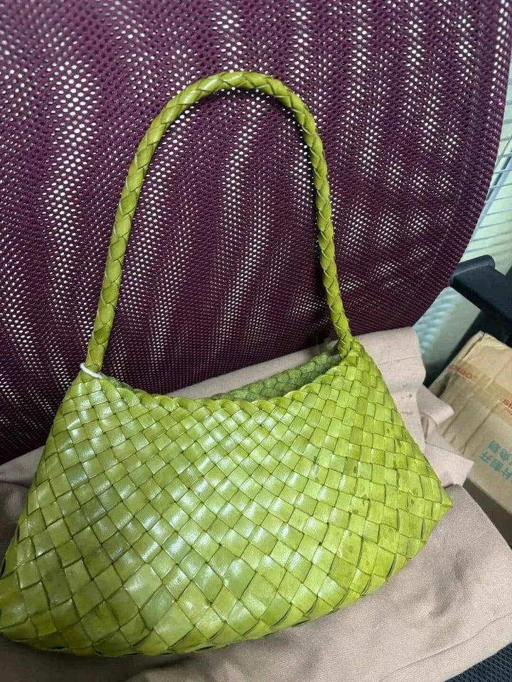 green dragon woven bag made of handwoven natural cow leather with a braided handle and spacious design