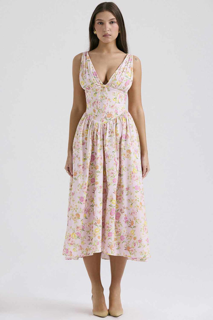 European style floral V-neck slip dress with a flowing long skirt and a fitted waist.
