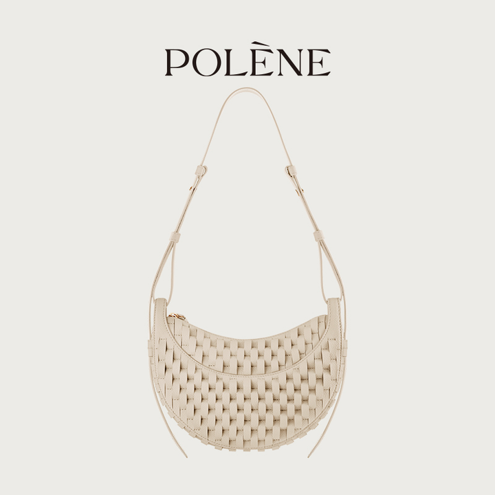 Polène Numéro Dix handcrafted woven leather crescent bag in ivory beige with adjustable strap and curved design