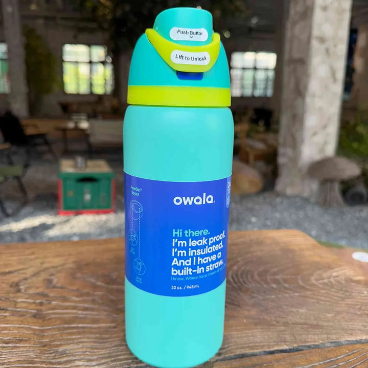 Owala FreeSip turquoise insulated stainless steel water bottle with dual spout and leak-proof design
