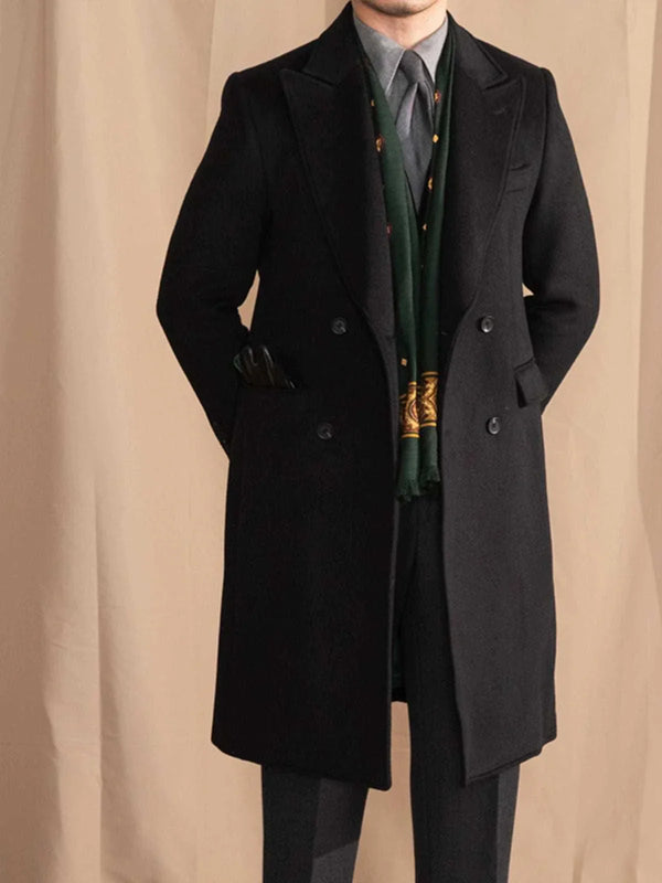 Mr. Lusan gentleman black British double-breasted wool coat with peak lapel and tailored fit.