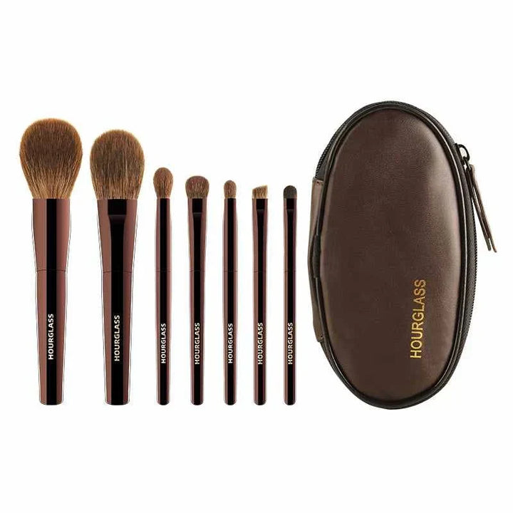 Hourglass professional 7-piece makeup brush set with elegant brown leather pouch for precise application.