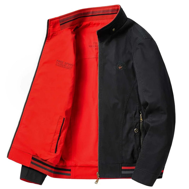 جاكيت رجالي قابل للعكس بألوان أسود من الخارج وأحمر من الداخل بجيب بسحاب وأزرار ضغط عند الياقة