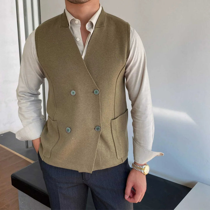 Mr. Lusan's British slim fit wool vest in olive green with double buttons and side pockets worn over white shirt
