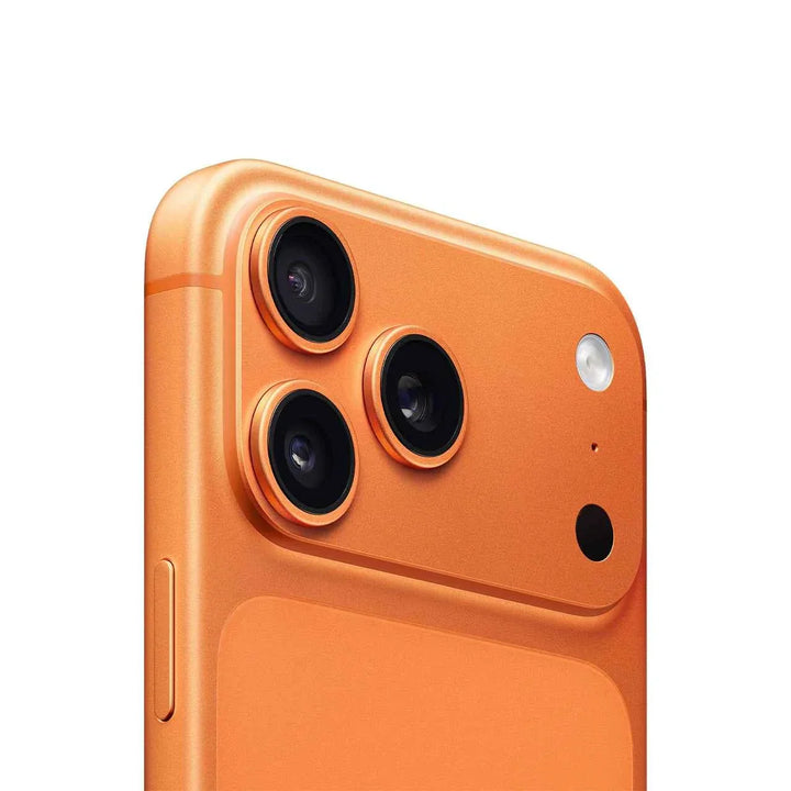 Close-up of the orange Apple iPhone 17 Pro Max rear triple camera system with aluminum body and sleek design