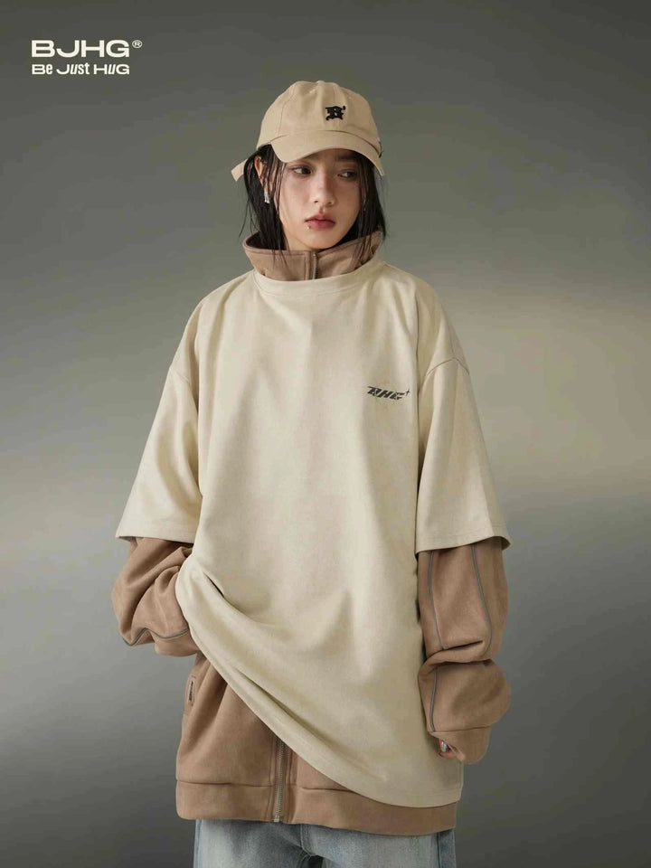 Casual beige تيشيرت نجمة with reflective star design, layered over brown hoodie, styled with beige cap.