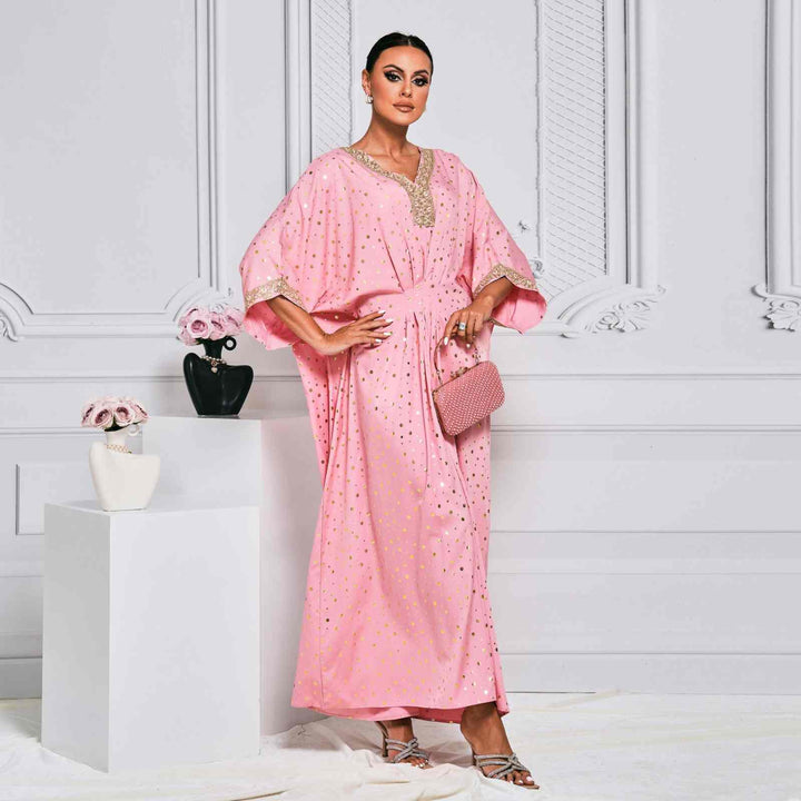 Elegant pink kaftan with gold dot embellishments and embroidered collar.