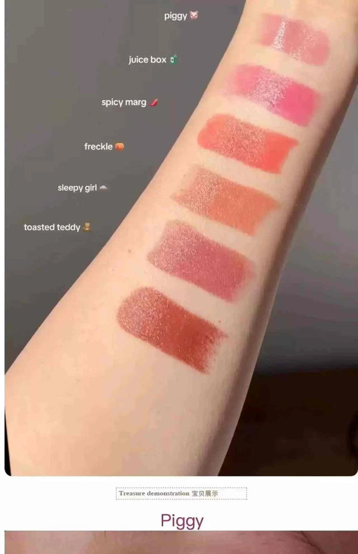 Swatches of Rhode Pocket Blush Stick shades on arm displaying Piggy, Juice Box, Spicy Marg, Freckle, Sleepy Girl, and Toasted Teddy colors