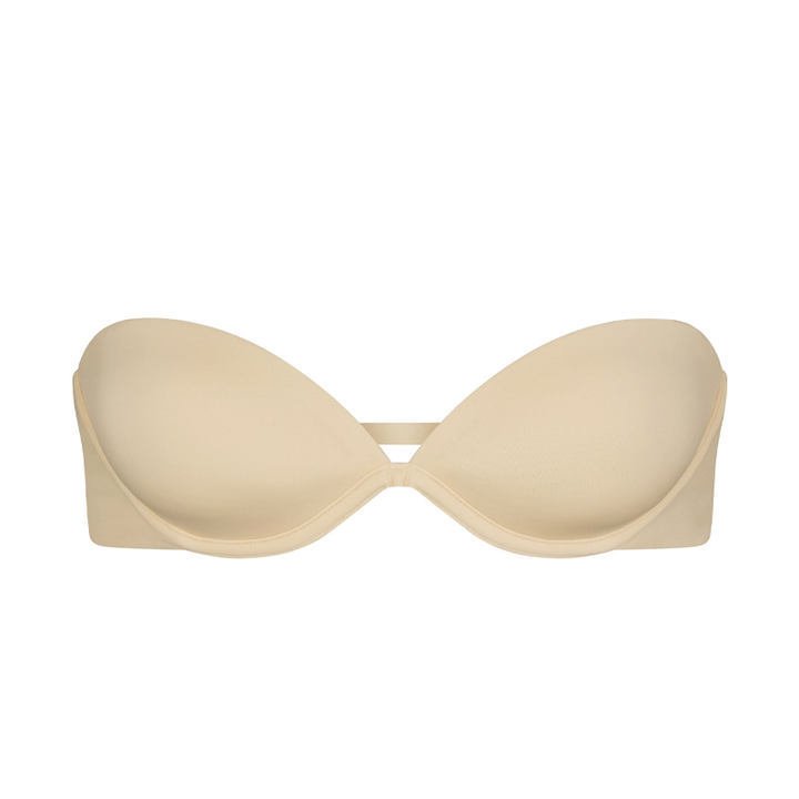 Creamy white SKIMS multi-way strapless bra with smooth finish and supportive design