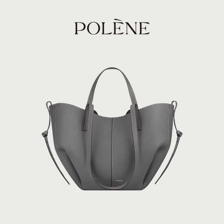 Polène Cyme Mini small gray leather tote bag with soft curves and dual open or closed flower design, handcrafted in Spain.