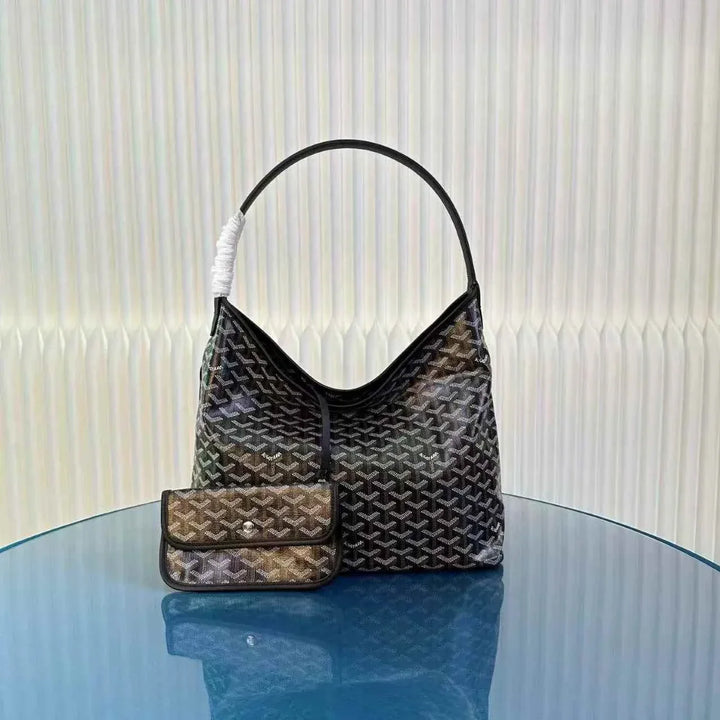 hobo bag shoulder bag with luxury geometric print and leather strap on blue reflective surface