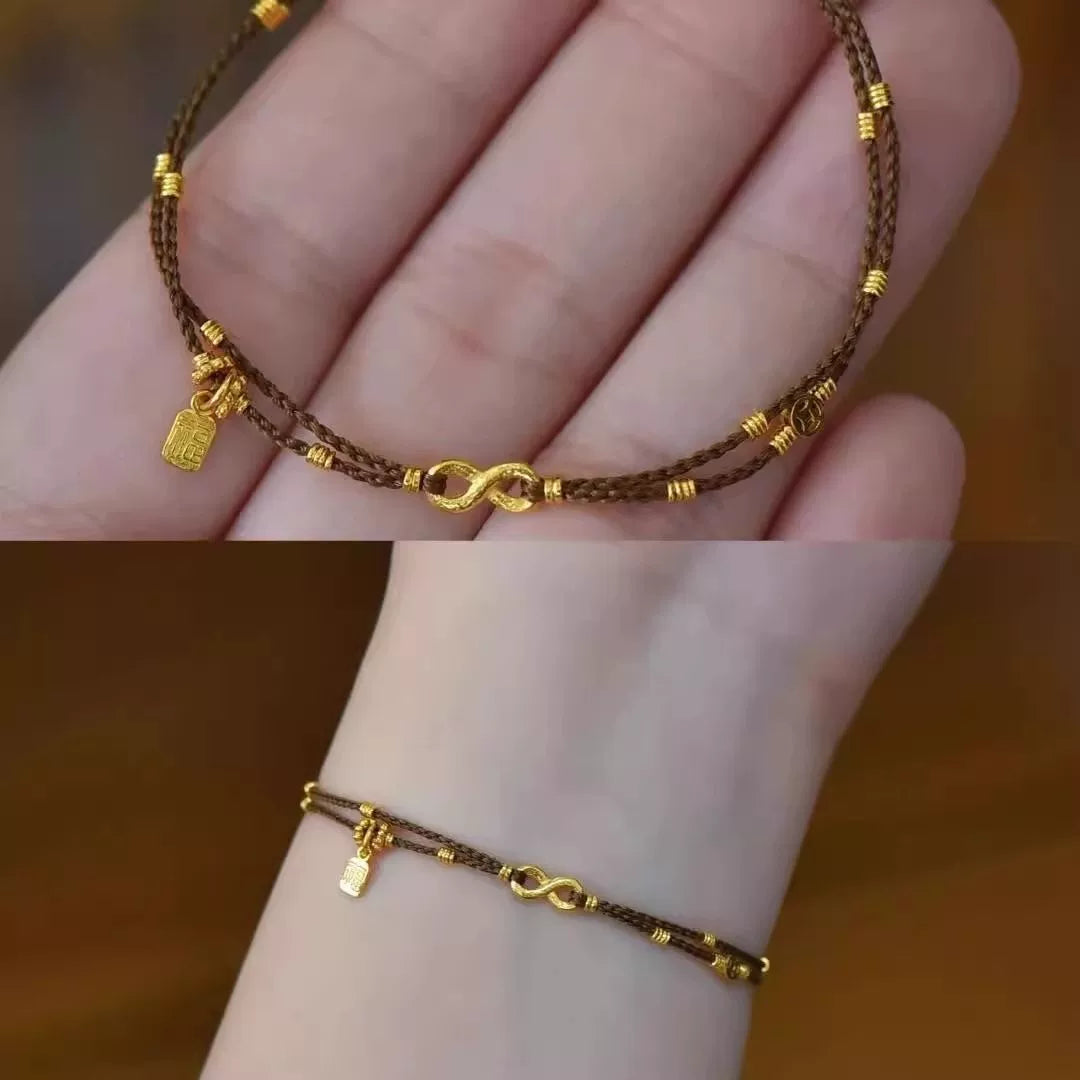 سوار نسائي بتصميم Infinity وخرز ذهبي ناعم.