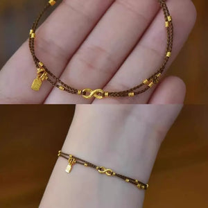 سوار نسائي بتصميم Infinity وخرز ذهبي ناعم.