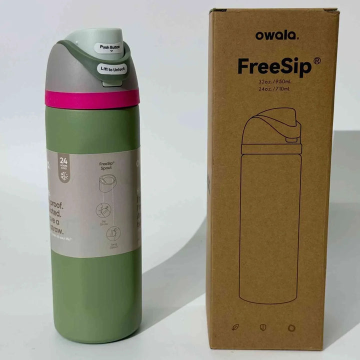 Owala Thermos CupKitty Limited Edition stainless steel green thermos with leak-proof lid and FreeSip spout next to its cardboard packaging