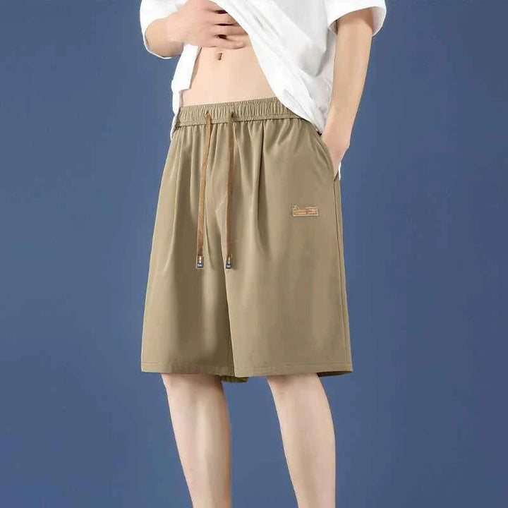 Men's khaki Ice Silk shorts with adjustable waistband and relaxed fit for comfort and breathability.