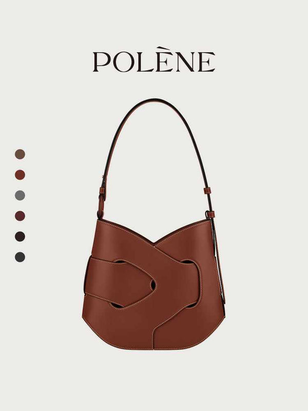 Polène Nodde Hobo bag in smooth full grain cowhide leather with adjustable shoulder strap and modern asymmetrical design.
