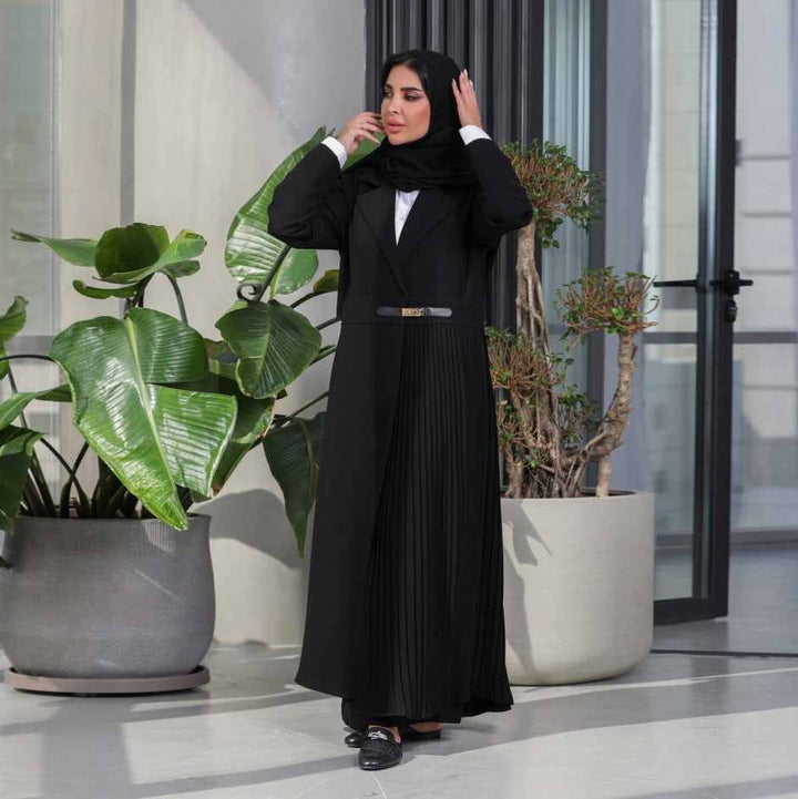 Luxurious pleated abaya coat with gold buckle belt, long classic collar, and sleeves, available in black and beige.