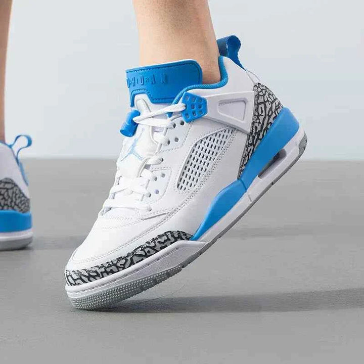 Nike men's JORDAN SPIZIKE LOW sneakers in white and university blue, showcasing iconic elements from five legendary Jordan shoes.