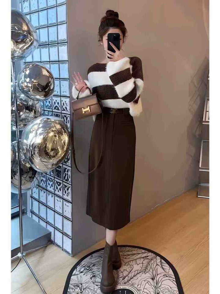 Elegant winter outfit with brown midi skirt and striped cardigan in brown and white colors
