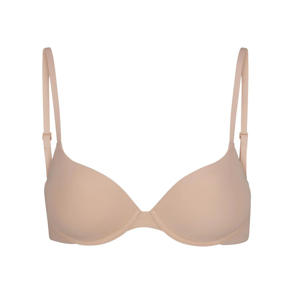 Soft supportive multicolor bra by SKIMS with smooth seamless design, adjustable straps, and underwire support in beige tone.