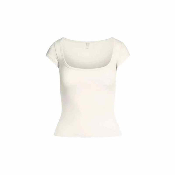 White SKIMS توب برقبة square neck essential tee made from soft stretchy fabric.