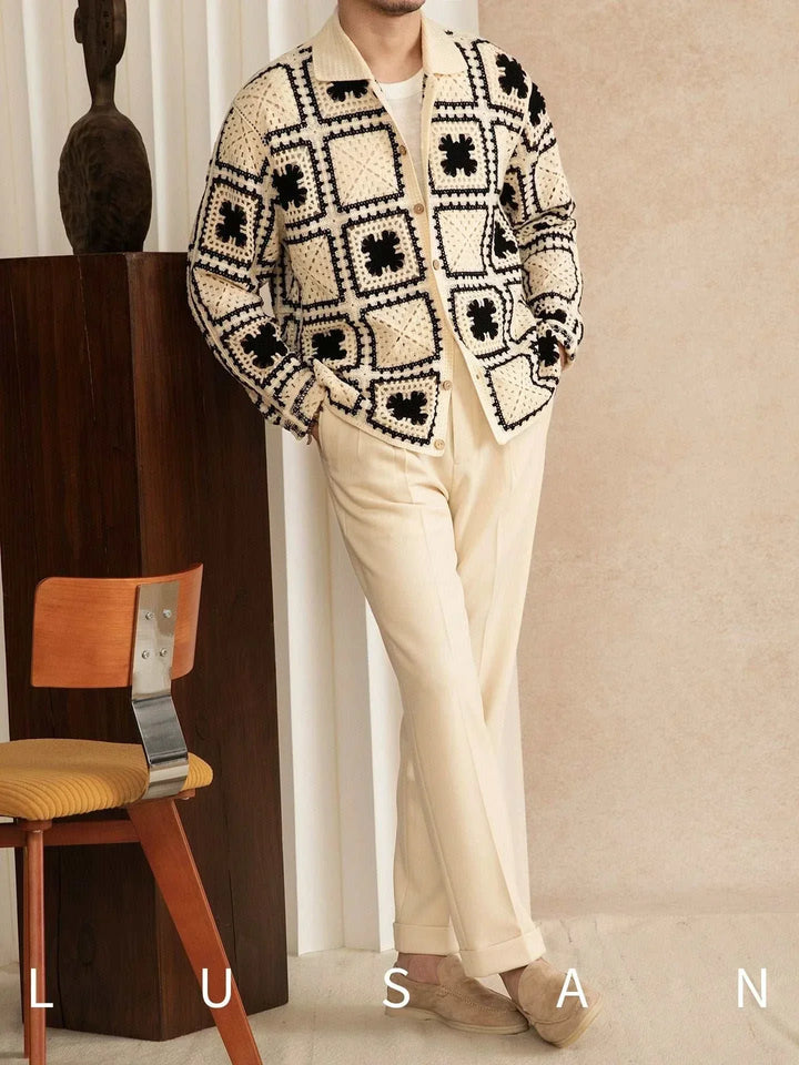 Mr. Lu San's autumn كارديجان knit cardigan with black and cream crochet squares and wooden buttons worn with beige pants