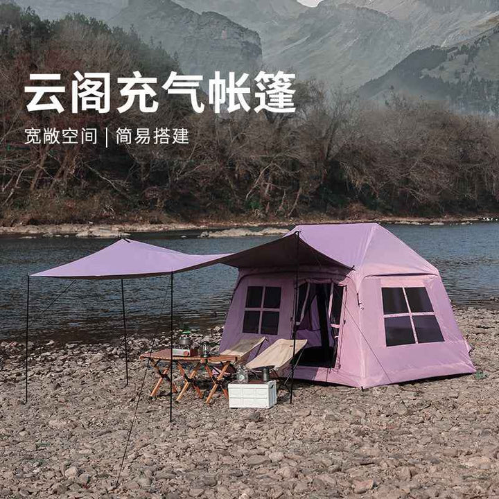 Wolf Walker Cloud Pavilion inflatable purple camping tent with large canopy set on rocky riverbank outdoors