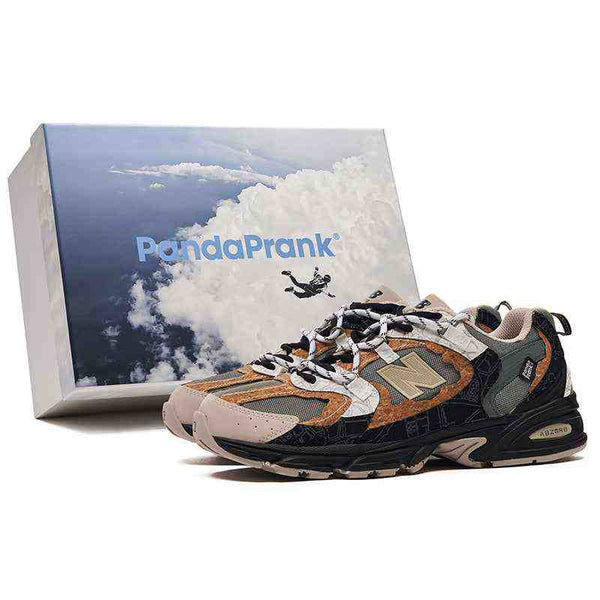 نيوبالانس New Balance × PandaPrank limited edition sneakers in beige, olive green, and black with leather accents and ABZORB cushioning next to a PandaPrank branded box