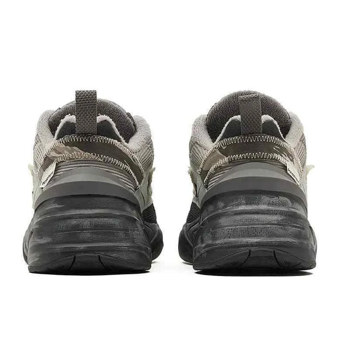 Rear view of Nike × PandaPrank limited edition sneakers in gray, black, green, and white with durable soles and detailed stitching