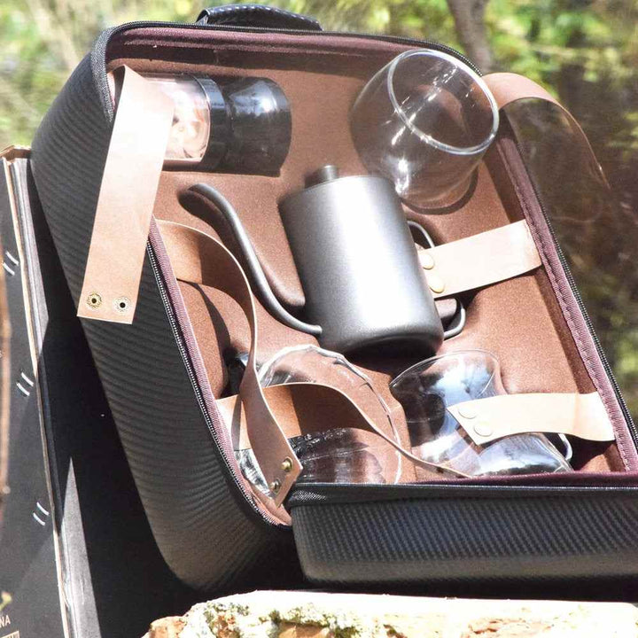 Hand coffee tools set in a stylish bag with multiple accessories for brewing coffee manually.