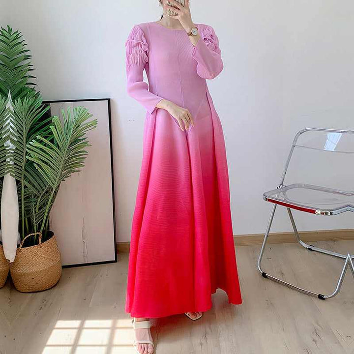 Long sleeve ombre dress with wide flowy design and puffed shoulders, ideal for various occasions.