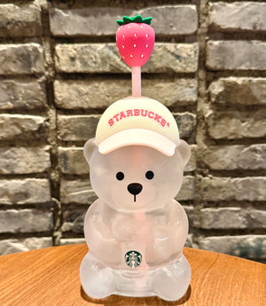 A close-up thumbnail of the starbucks bear cup 2026 pink against a brick wall, capturing the design of كوب ستاربكس الدبدوب الوردي 2026 آخر اصدار.