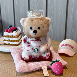 Top view of the Starbucks bearista cup pink showing the removable pink hat lid and strawberry-themed accessories.