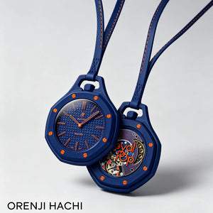 Two dark blue Orenji Hachi bioceramic pocket watches displaying the intricate inner gears through the sapphire crystal.