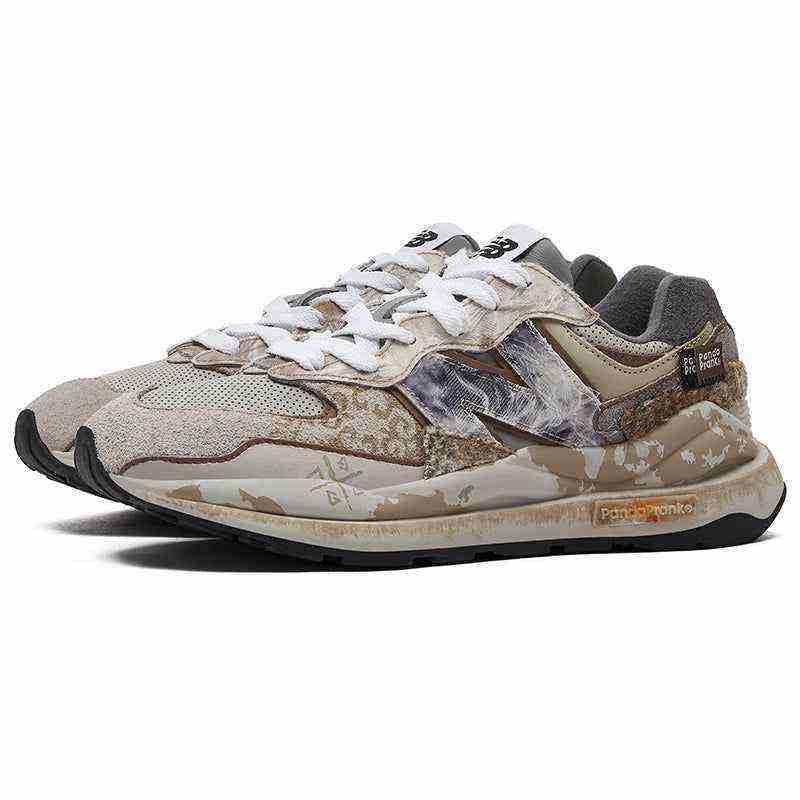 Three-quarter view of custom distressed multi-patterned New Balance running shoes.
