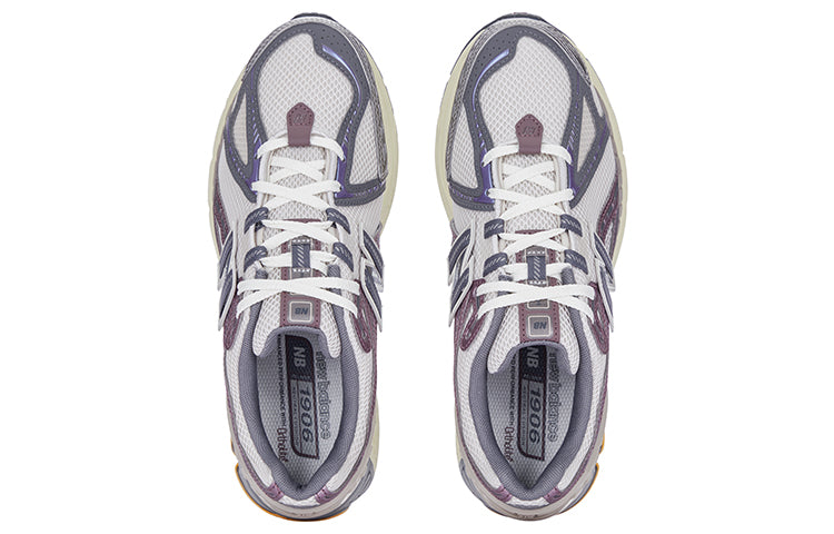 Top-down aerial view of a pair of grey and purple New Balance shoes 1906R model, displaying off-white mesh uppers, slate grey and metallic mauve overlays, cream laces, grey padded collar lining, and grey branded OrthoLite insoles.
