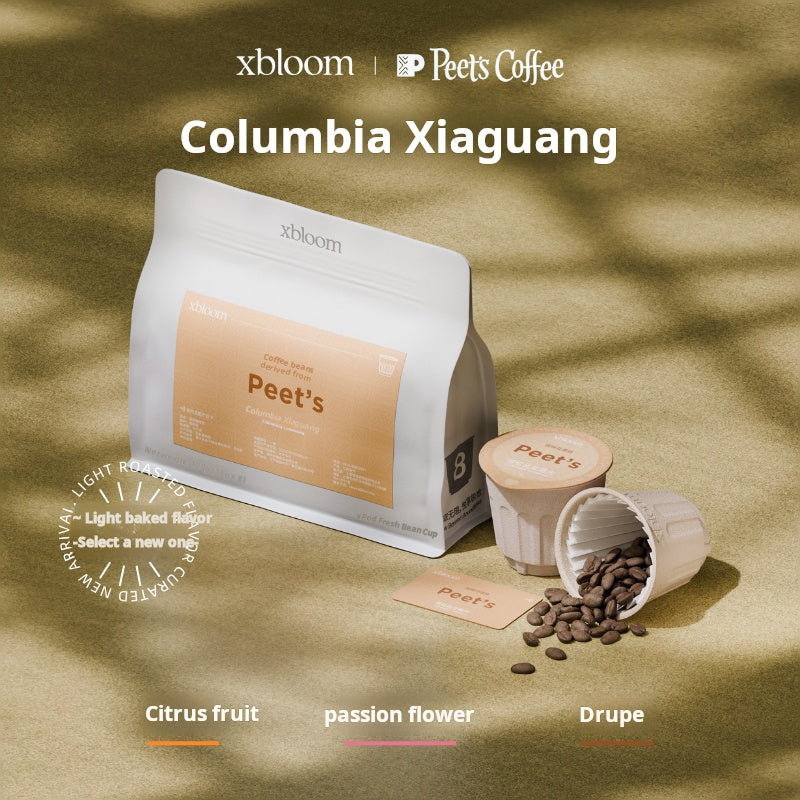A promotional image featuring an XBloom Peet's Coffee bag and XBloom xpods coffee capsules, with 'Columbia Xiaguang' text at the top and color-coded flavor notes for Citrus fruit, passion flower, and Drupe at the bottom.