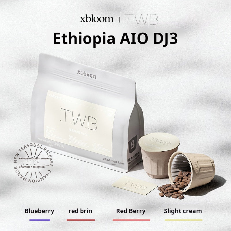 A white coffee bag with 'TWB' label next to individual XBloom xpods coffee capsules, featuring flavor notes for Blueberry, red brim, Red Berry, and Slight cream at the bottom.