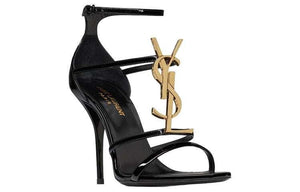 صندل كعب عالي Saint Laurent بتصميم شعار YSL ذهبي ولون أسود.