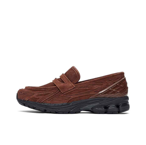 Brown New Balance 1906 loafers with black rubber sole and mesh leather upper