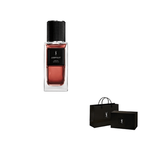 زجاجة عطر مع حقائب تسوق سوداء